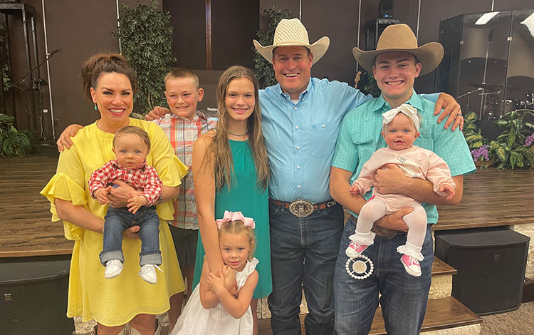 All-Around Cowboy, Cash Myers, and his family smile for a picture.